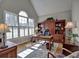 Bright office with built-in shelving, hardwood floors, large windows, and natural light at 112 Estates At The Lake Dr, Canton, GA 30114