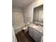 This bathroom offers a tub/shower, granite counters, and vinyl plank flooring at 116 Deer Xing, Temple, GA 30179