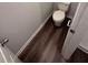 Bathroom with vinyl plank flooring featuring a toilet, base trim, and painted walls at 116 Deer Xing, Temple, GA 30179