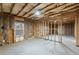 Unfinished basement with exposed framing and insulation, ready for customization at 411 Spring Lake Hls, White, GA 30184