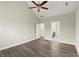 Bright bedroom features a ceiling fan, wood flooring, and neutral paint, creating a peaceful retreat at 411 Spring Lake Hls, White, GA 30184