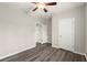 Bedroom showcasing floors, closet, and open door to another room in neutral colors at 411 Spring Lake Hls, White, GA 30184