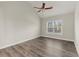 Bedroom with grey walls, window with blinds and hardwood floors at 411 Spring Lake Hls, White, GA 30184