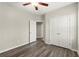Bedroom showcasing floors, closet, and open door to another room in neutral colors at 411 Spring Lake Hls, White, GA 30184