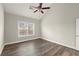 Bedroom with hardwood floors, grey walls, window with blinds, and a ceiling fan at 411 Spring Lake Hls, White, GA 30184