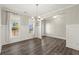 Bright dining room featuring natural light and a stylish chandelier at 411 Spring Lake Hls, White, GA 30184