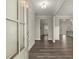 Entryway with hardwood floors leading to an open-concept living area at 411 Spring Lake Hls, White, GA 30184