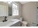 Bathroom featuring gray vanity, light countertop and tiled shower at 4620 Central Dr, Stone Mountain, GA 30083