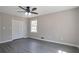 Bedroom featuring new flooring, neutral paint and ceiling fan at 4620 Central Dr, Stone Mountain, GA 30083