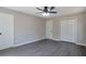 Bedroom featuring new flooring, ceiling fan and neutral color palette at 4620 Central Dr, Stone Mountain, GA 30083