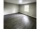 Spacious bedroom featuring gray walls, modern flooring, and natural light for a serene atmosphere at 4620 Central Dr, Stone Mountain, GA 30083