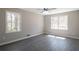 Bedroom with new flooring, neutral color palette and updated windows at 4620 Central Dr, Stone Mountain, GA 30083