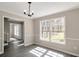 Elegant dining room with large windows, stylish lighting, and gray wood floors at 4620 Central Dr, Stone Mountain, GA 30083