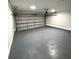 Spacious two-car garage with neutral paint and an automatic door, ready for vehicles or storage at 4620 Central Dr, Stone Mountain, GA 30083