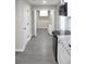 Open kitchen featuring new cabinets, granite countertops, stainless steel appliances, and new flooring at 4620 Central Dr, Stone Mountain, GA 30083