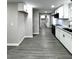 Open kitchen featuring new cabinets, granite countertops, stainless steel appliances, and new flooring at 4620 Central Dr, Stone Mountain, GA 30083