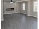 Open concept living room featuring fireplace and modern lighting at 4620 Central Dr, Stone Mountain, GA 30083