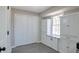 Bright pantry with white cabinets, granite countertop and gray flooring at 4620 Central Dr, Stone Mountain, GA 30083