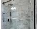 Modern bathroom shower featuring gray tiled walls and a sleek black shower head and handle at 4620 Central Dr, Stone Mountain, GA 30083