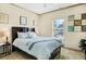 Cozy bedroom featuring a comfortable bed, neutral decor, and a bright window at 5156 Olive Branch Cir, Powder Springs, GA 30127