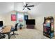 Large game room with an arcade game, desk, TV, and sports memorabilia at 5156 Olive Branch Cir, Powder Springs, GA 30127