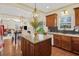 Open-concept kitchen with granite countertops, stainless steel appliances, and island with seating at 5156 Olive Branch Cir, Powder Springs, GA 30127