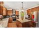 Well-equipped kitchen featuring stainless steel appliances, island and dark backsplash at 5156 Olive Branch Cir, Powder Springs, GA 30127