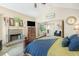 Spacious main bedroom with fireplace, seating area, vaulted ceiling, and neutral walls at 5156 Olive Branch Cir, Powder Springs, GA 30127