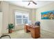 Bright office with a large window, desk, comfortable chair, and a plant at 5156 Olive Branch Cir, Powder Springs, GA 30127