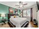 Inviting bedroom with modern decor, natural light, ceiling fan, and neutral carpet with a platform bed at , Tucker, GA 30084