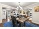 View from dining area into the kitchen and living room, creating an open floor plan perfect for entertaining at 3515 Montreal Way, Tucker, GA 30084