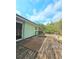 View of back porch with wooden flooring with access from inside of home at 2022 Cook Rd, Decatur, GA 30032