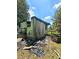 Exterior view of the fire-damaged building with debris on the ground at 2022 Cook Rd, Decatur, GA 30032