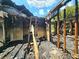 Interior view of the fire-damaged home with exposed studs and debris at 2022 Cook Rd, Decatur, GA 30032