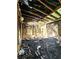 Interior view of a fire damaged house, showing the extent of the damage to the living room and ceiling at 2022 Cook Rd, Decatur, GA 30032