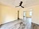 Living room featuring laminate wood flooring, yellow walls, and natural lighting at 2022 Cook Rd, Decatur, GA 30032