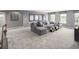 Finished basement area with plush carpeting, a comfortable sectional, and ample room for entertaining at , Locust Grove, GA 30248