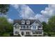 Charming two-story home with a classic design, dormer windows, and a covered front porch at , Locust Grove, GA 30248