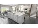 Open-concept kitchen with a large island, granite countertops, and seamless flow to the living area at , Locust Grove, GA 30248