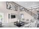 Spacious living room with a two-story ceiling, staircase, and stylish neutral decor at , Locust Grove, GA 30248