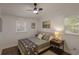 Bright bedroom featuring dark trim, hard wood floors and decorative wall art at 1000 Bozeman Dr, Atlanta, GA 30341