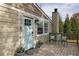 Charming front porch with a light-blue door, decorative chairs and lovely potted plants at 1000 Bozeman Dr, Atlanta, GA 30341