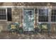 Inviting front porch with stylish decor and a cheerful light-blue front door at 1000 Bozeman Dr, Atlanta, GA 30341