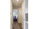 Hallway leading to a bedroom with hardwood floors and a light grey color palette at 1000 Bozeman Dr, Atlanta, GA 30341