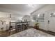 Bright living area featuring a bar area, hardwood floors, and updated finishes throughout at 1000 Bozeman Dr, Atlanta, GA 30341
