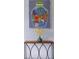Fun wall art depicting Atlanta over an accent table with flower arrangement at 1000 Bozeman Dr, Atlanta, GA 30341