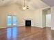 Living room with a fireplace, ceiling fan and hardwood flooring at 107 Deer Park Dr, Carrollton, GA 30116