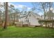 Well-maintained backyard with large deck, mature trees and green grass at 2086 Mountain Creek Ct, Stone Mountain, GA 30087
