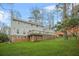 Spacious backyard with a wooden deck and lush green lawn, perfect for outdoor gatherings at 2086 Mountain Creek Ct, Stone Mountain, GA 30087