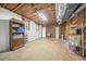 Unfinished basement with exposed ceiling and concrete floor, offering ample storage space at 2086 Mountain Creek Ct, Stone Mountain, GA 30087